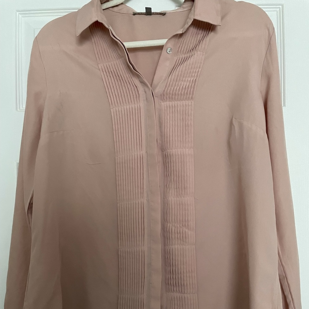 Light pink buttoned down blouse